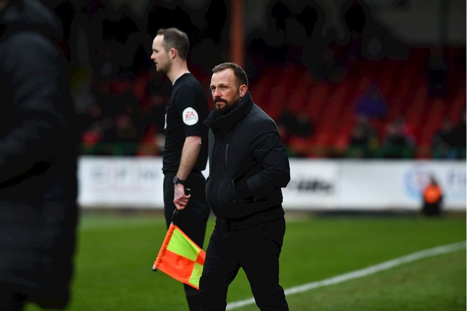 Swindon Town have parted company with head coach Jody Morris